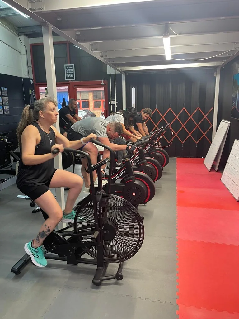 Challenge Life members training together on air bikes